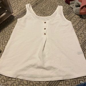 a white buttoned up tank top !